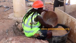 A woman washing for gold at Wassa Gyapa